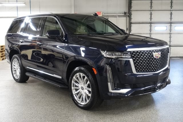 2023 Cadillac Escalade Premium Luxury in Dark Moon Blue Metallic — front three-quarter view